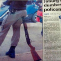policeman_sitting_on_rifle.jpg
