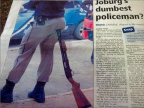 Policeman sitting on rifle