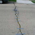 Taping cracks in the road
